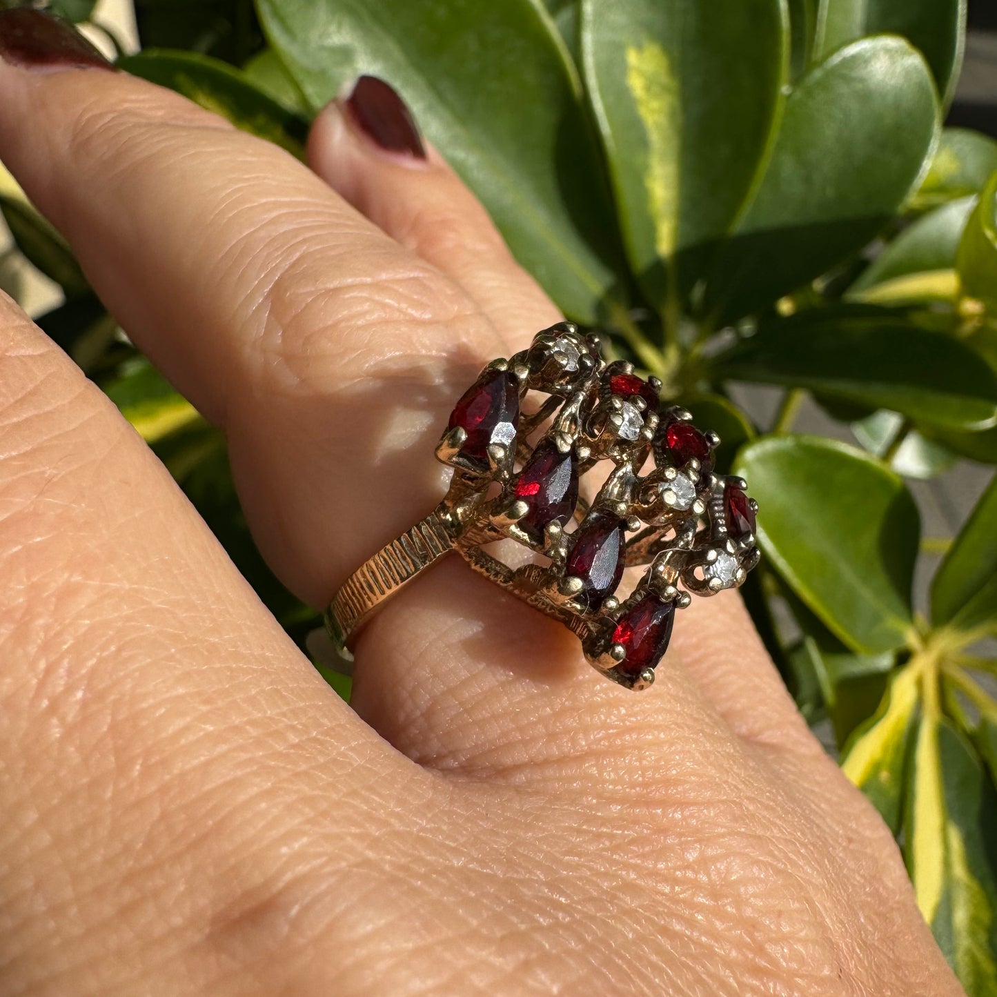14K gold ring set with deep red teardrop Garnets and sparkling Diamonds in an openwork geometric design