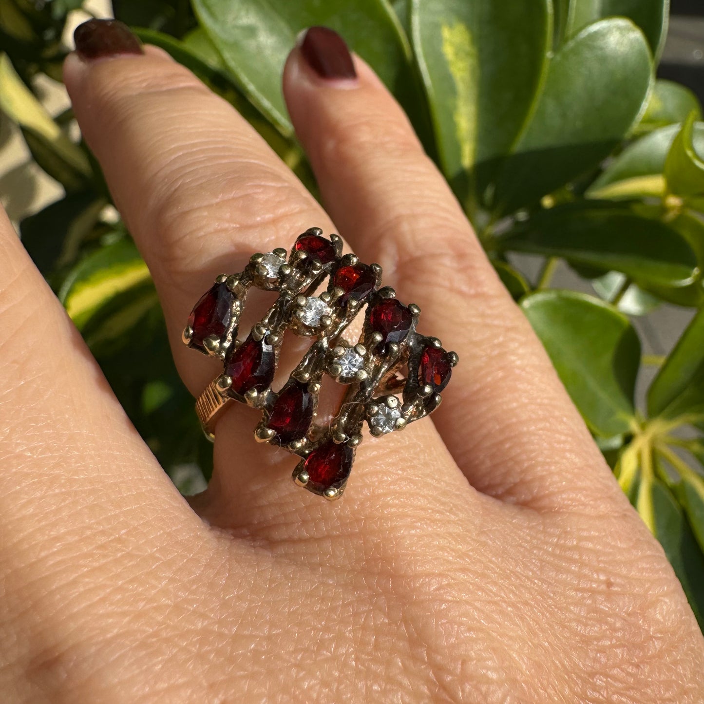 14K gold ring set with deep red teardrop Garnets and sparkling Diamonds in an openwork geometric design