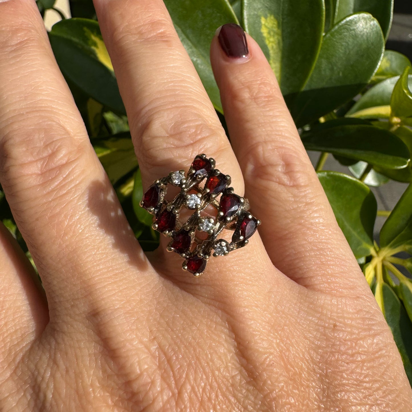 14K gold ring set with deep red teardrop Garnets and sparkling Diamonds in an openwork geometric design