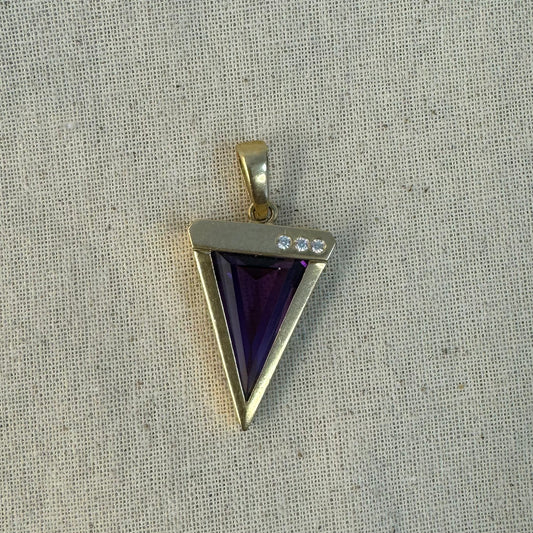 14K yellow gold pendant set with a triangular-cut amethyst and three accent diamonds