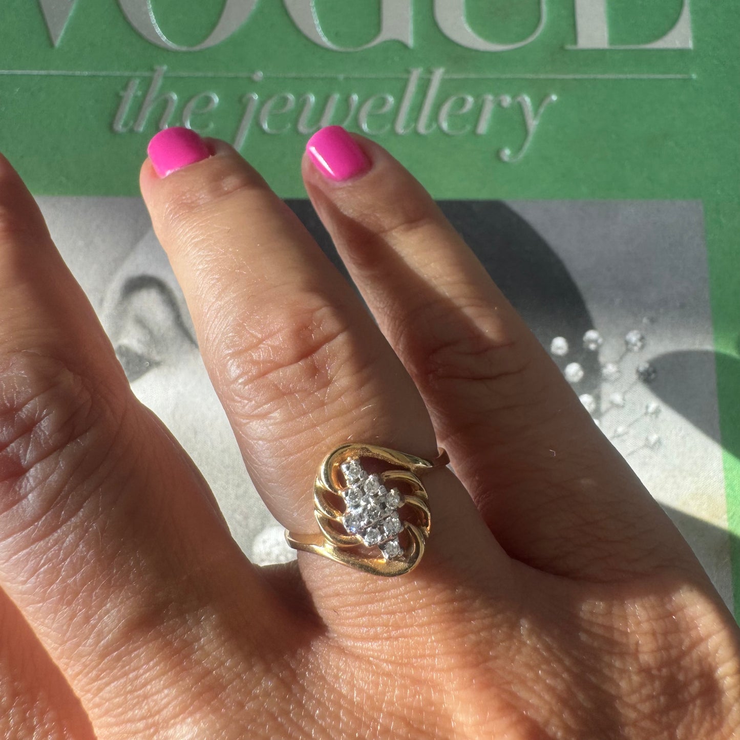 14K gold set with a cluster of sparkling Diamonds at its center