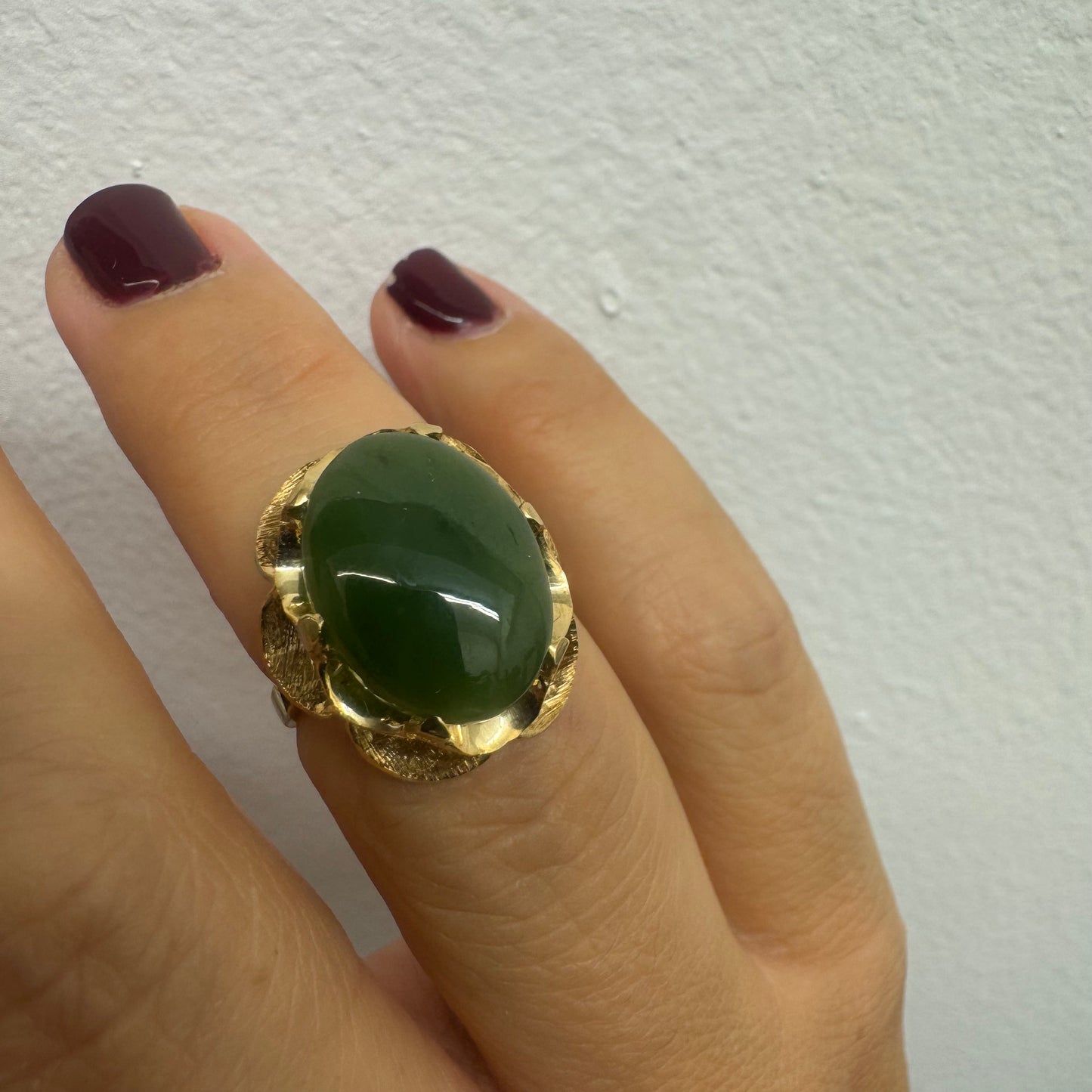 14K gold ring set with a large green Jade cabochon
