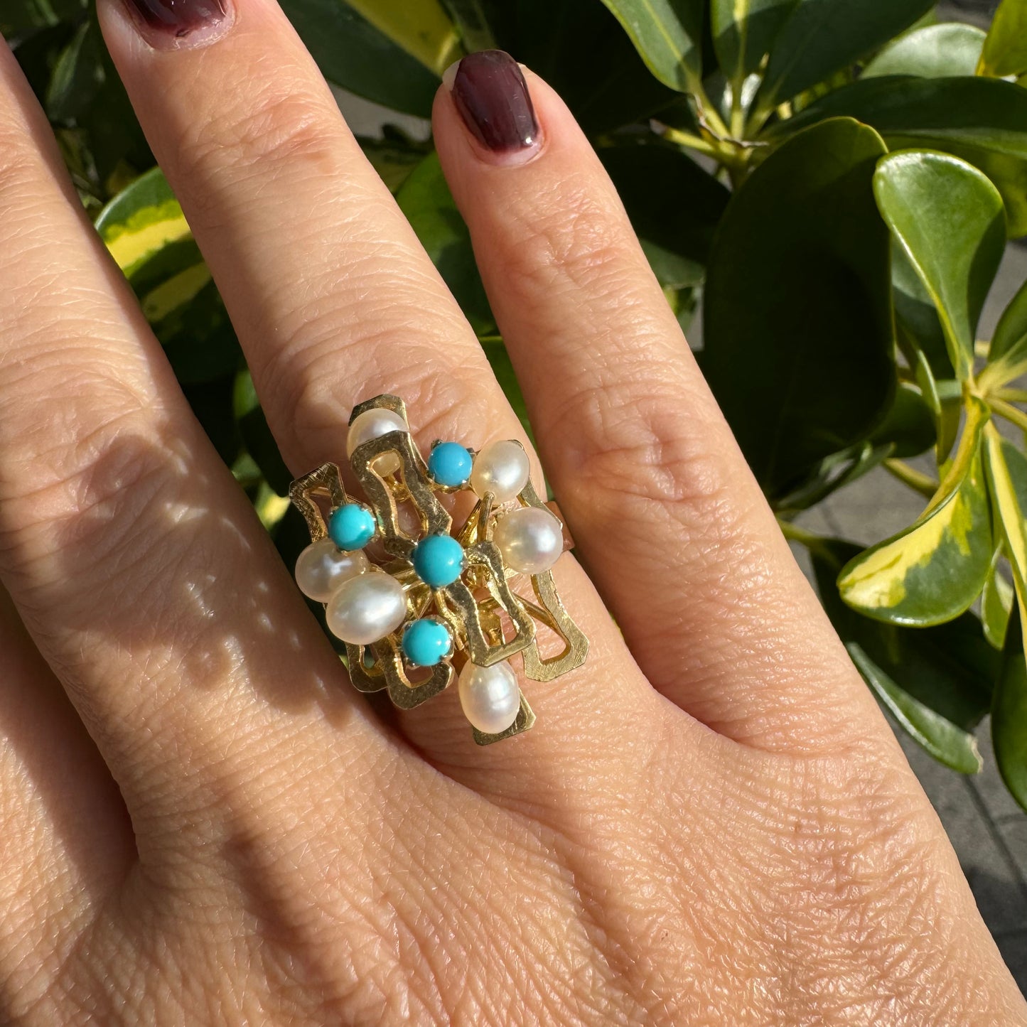 14K gold ring with a textured design, set with round white pearls and turquoise stones for a striking contrast.