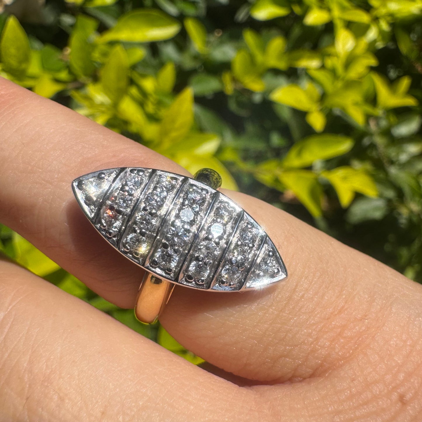 18K gold marquise-shaped ring set with multiple rows of sparkling Diamonds