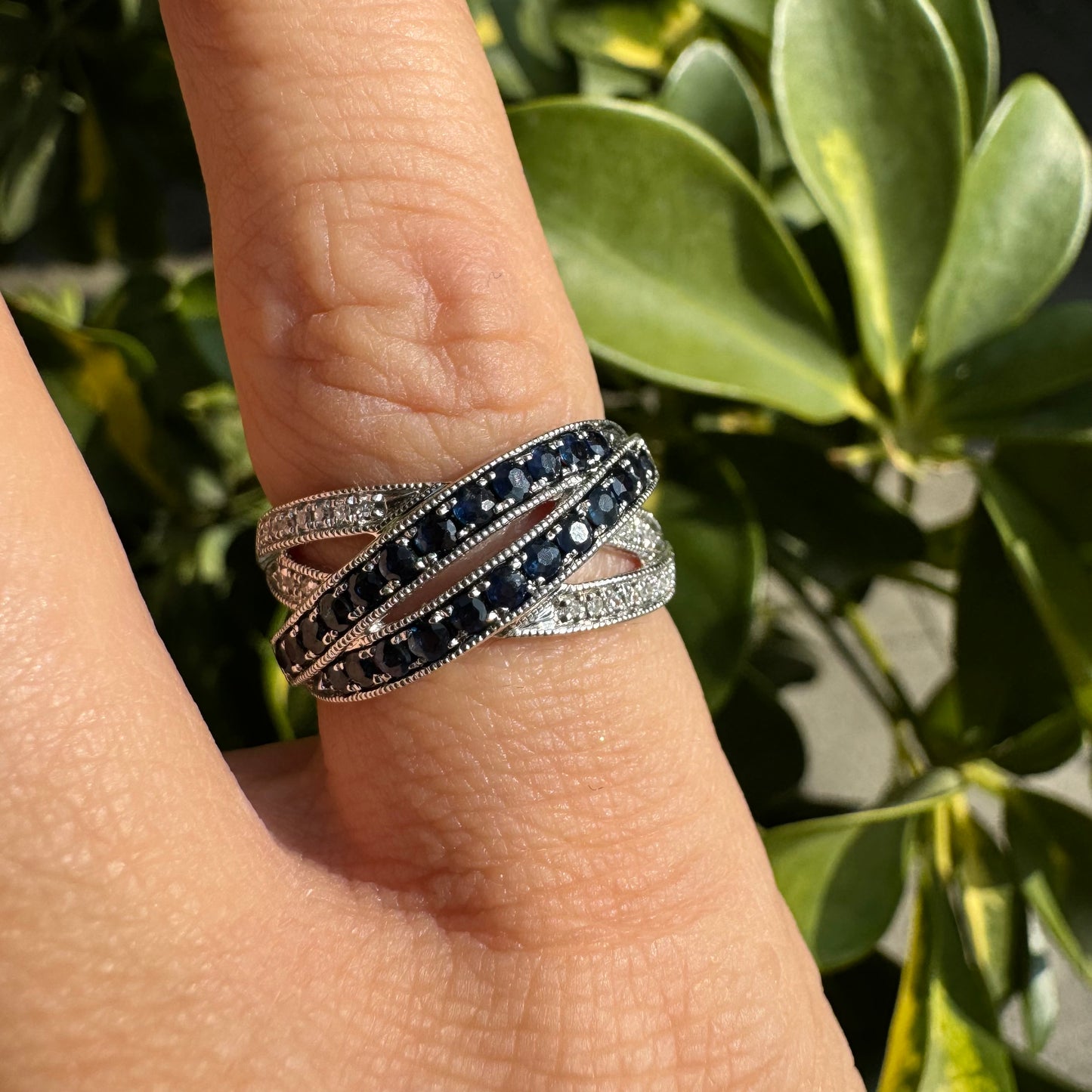 14K gold crossover ring set with Sapphires and sparkling Diamonds