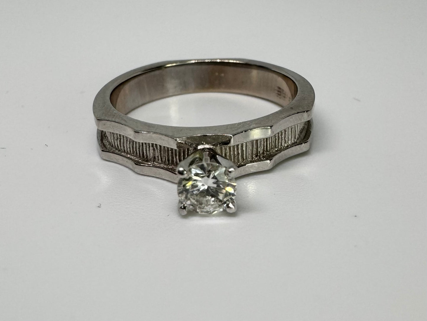 14K gold ring set with one center Diamond