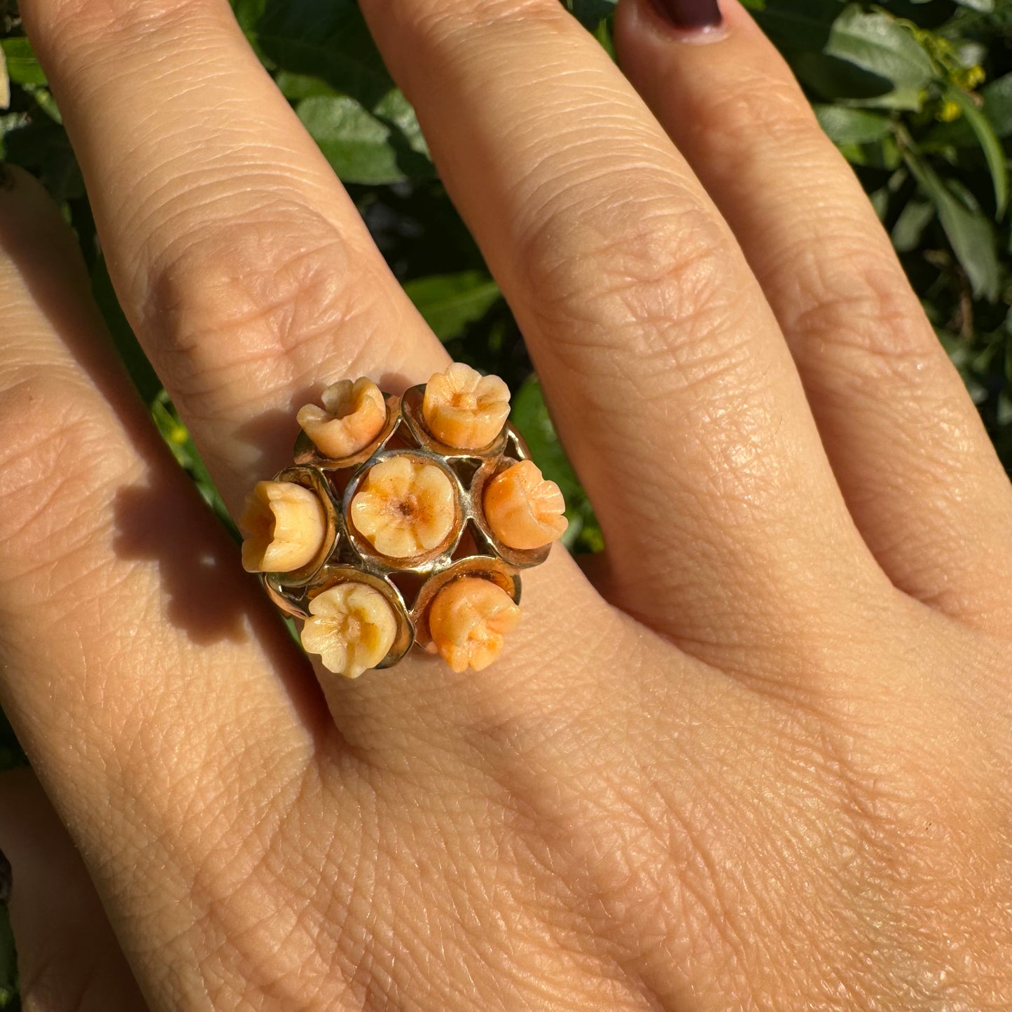9K gold ring featuring a cluster design with carved Coral flowers in warm orange tones