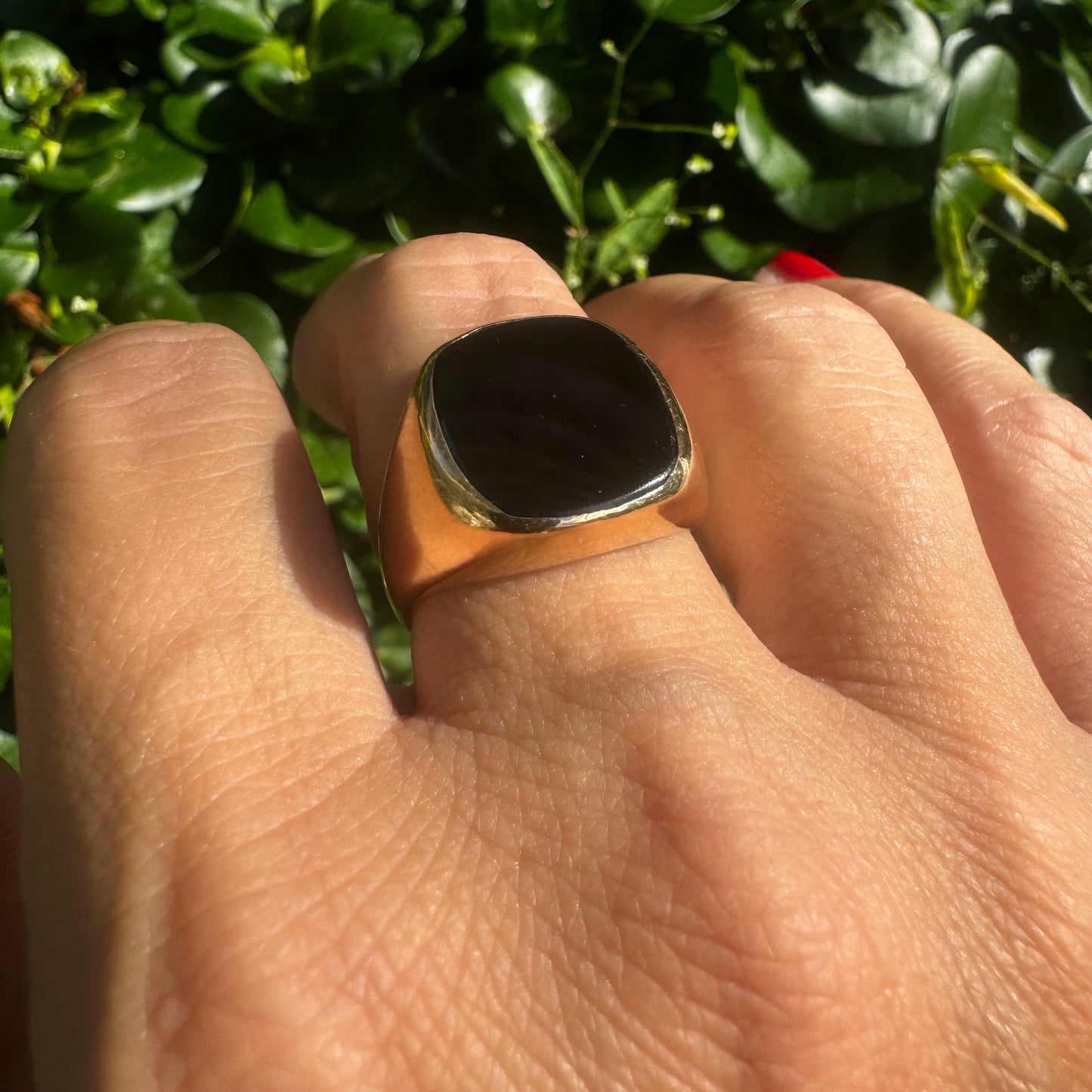 14K bold gold ring set with a smooth, square-shaped black Onyx that creates a sleek and striking look.