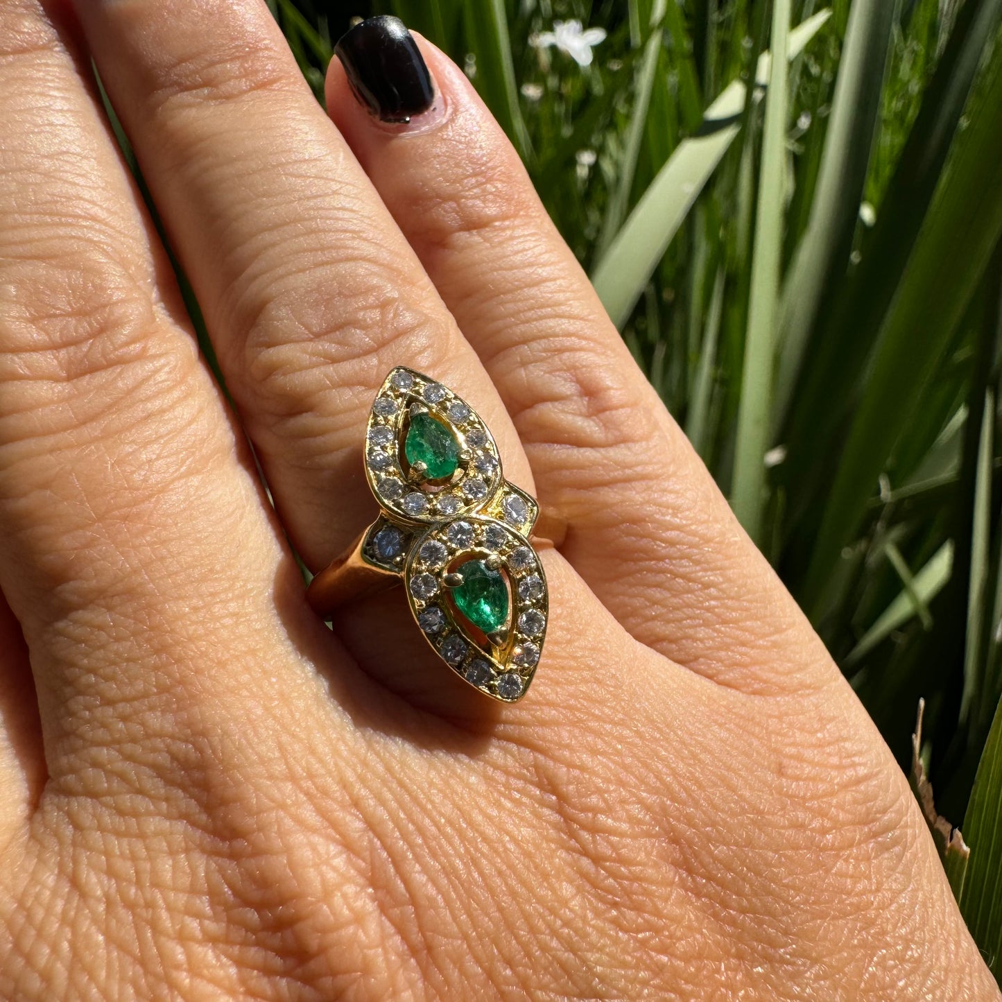 18K gold ring set with two pear-cut Emeralds & Diamonds