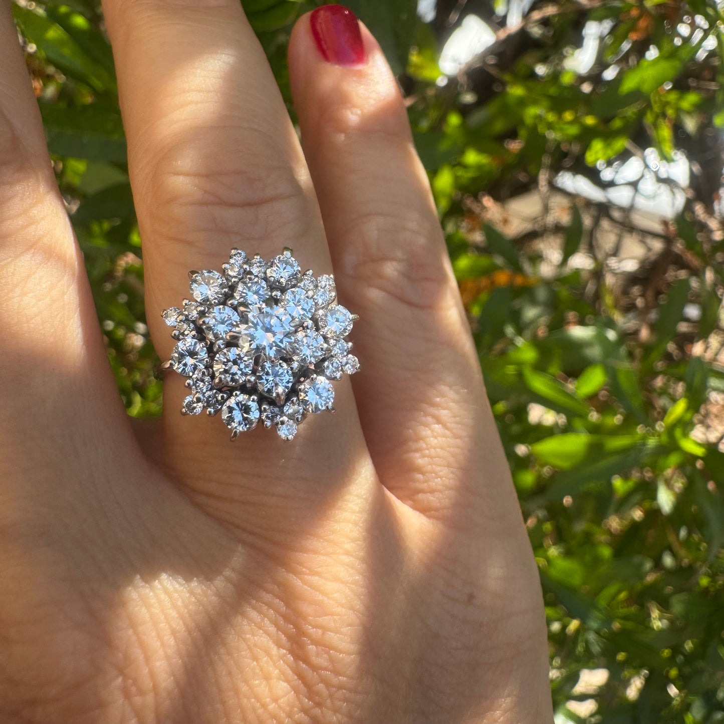 18K gold ring set with sparkling white Diamonds arranged in a floral cluster design