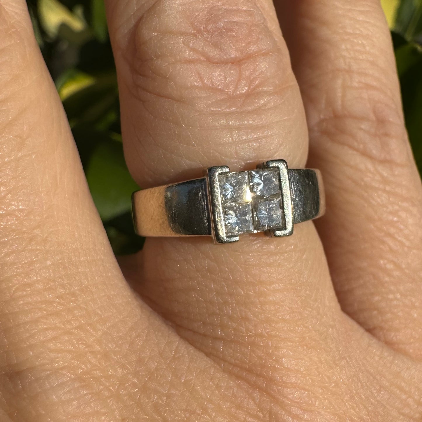 14K gold ring set with 4 square-cut Diamonds