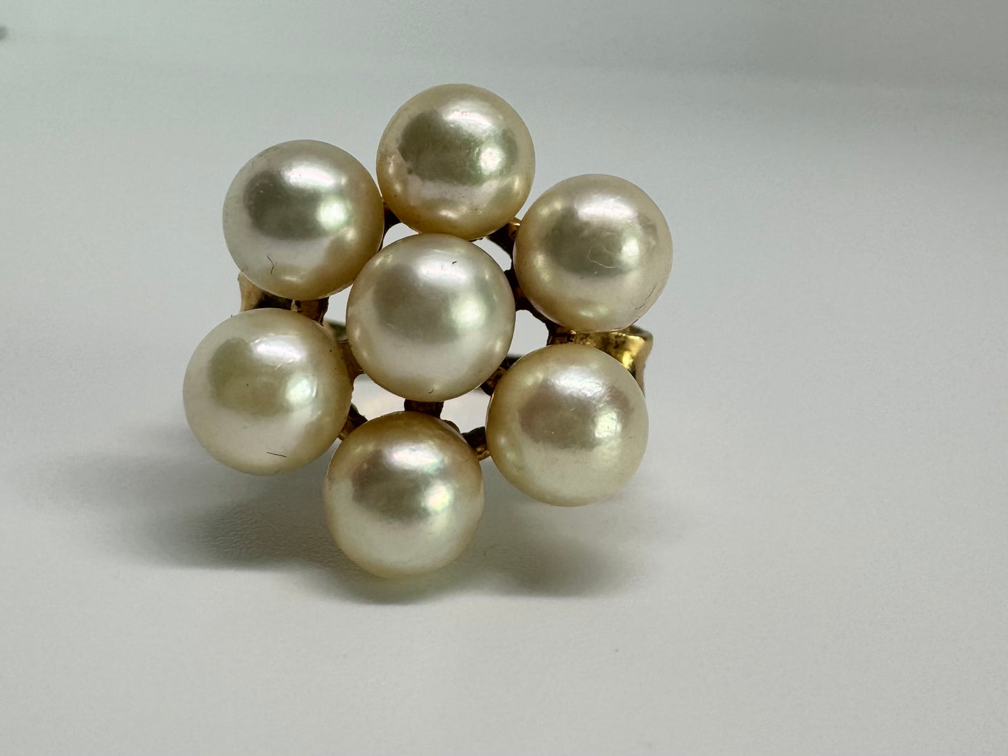 14K gold ring set with seven round Pearls in a bold floral cluster