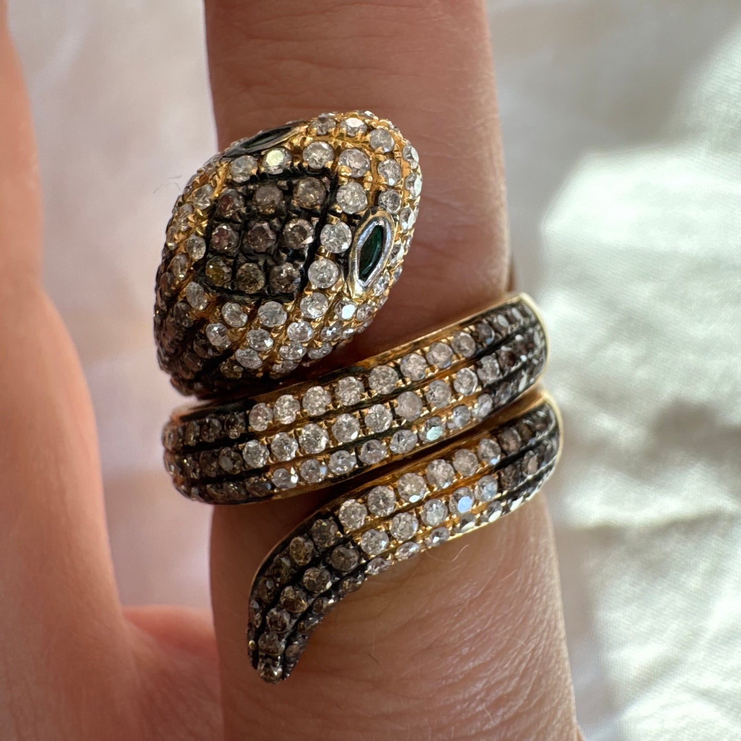 14K gold snake ring fully set with white and black Diamonds, creating a striking contrast and luxurious sparkle.