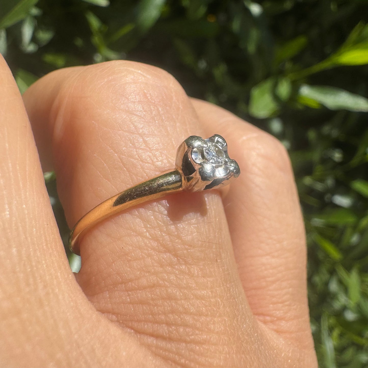 14K gold solitaire ring set with a small round Diamond