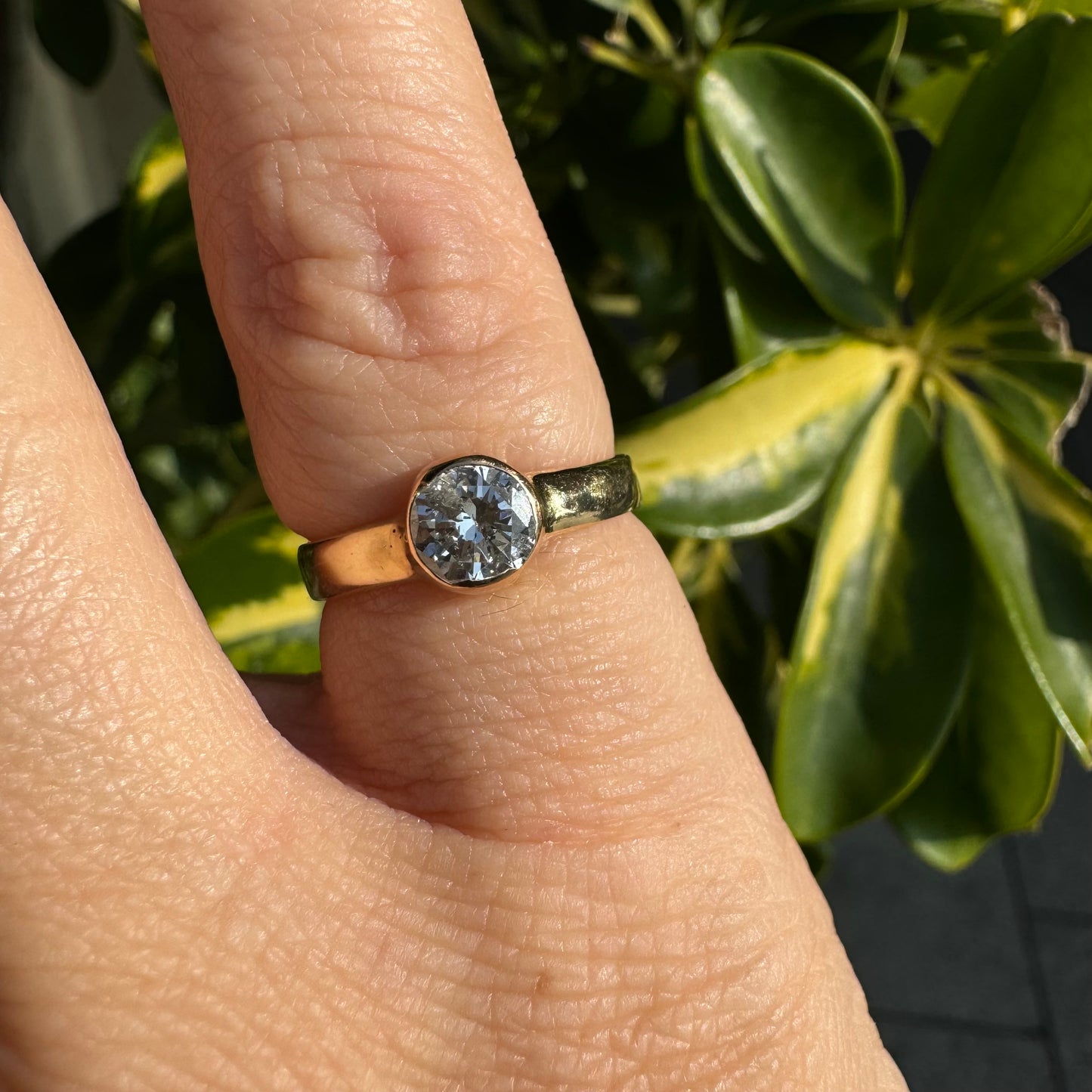 14K gold ring set with one center Diamond