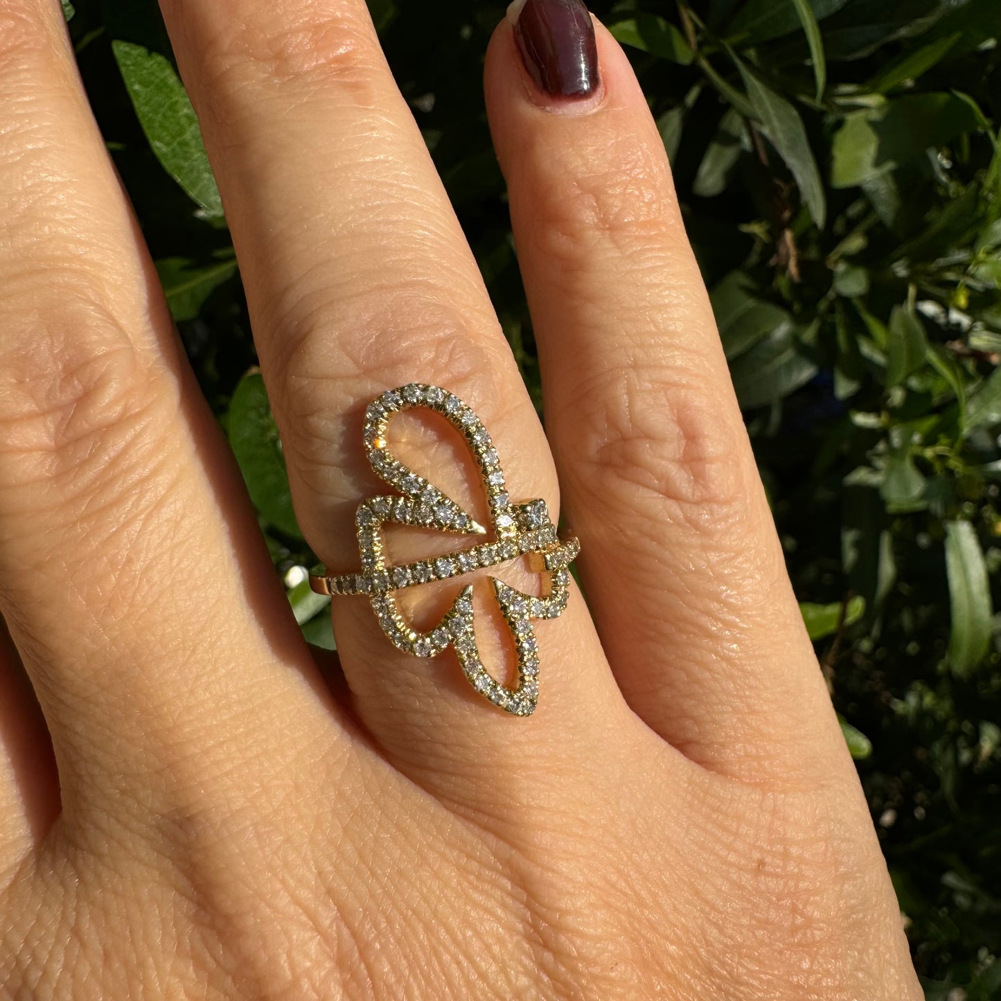 14K gold ring in an open butterfly design, outlined with sparkling Diamonds