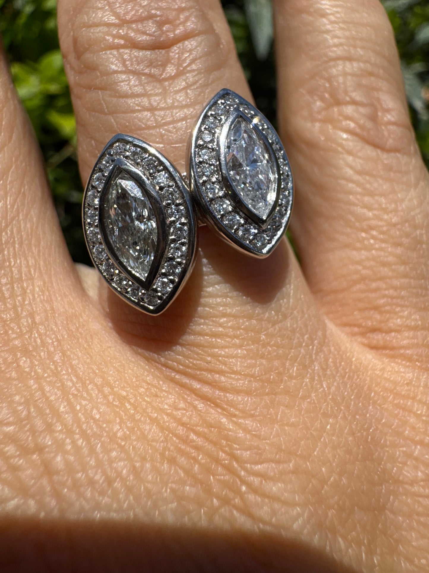 18K gold convertible ring set with two marquise-cut diamond halos that magnetically connect into a bold statement piece