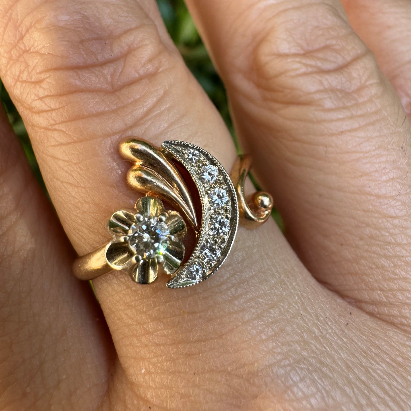 14K gold ring with a delicate moon and star motif set with Diamonds
