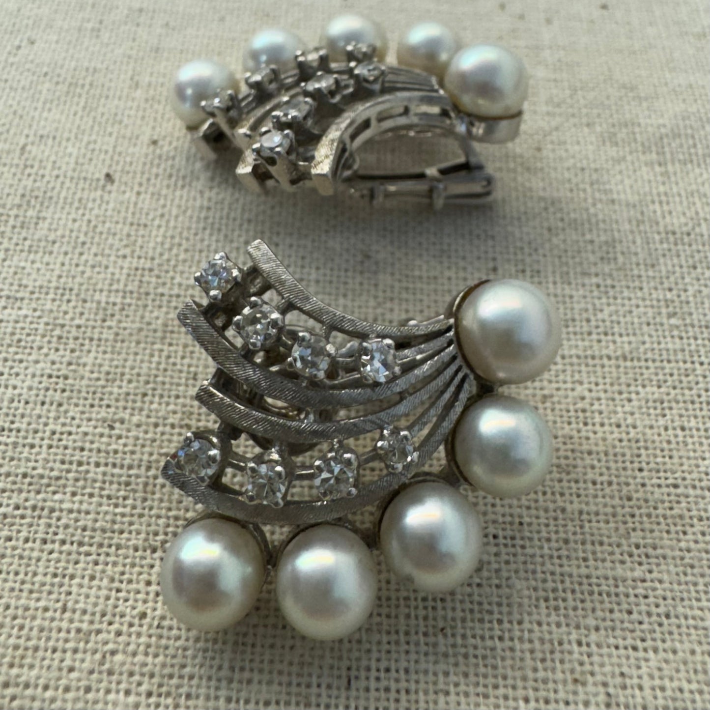 14K gold clip-on earrings inspired by 1950s Hollywood style, set with a row of luminous round pearls & Diamonds