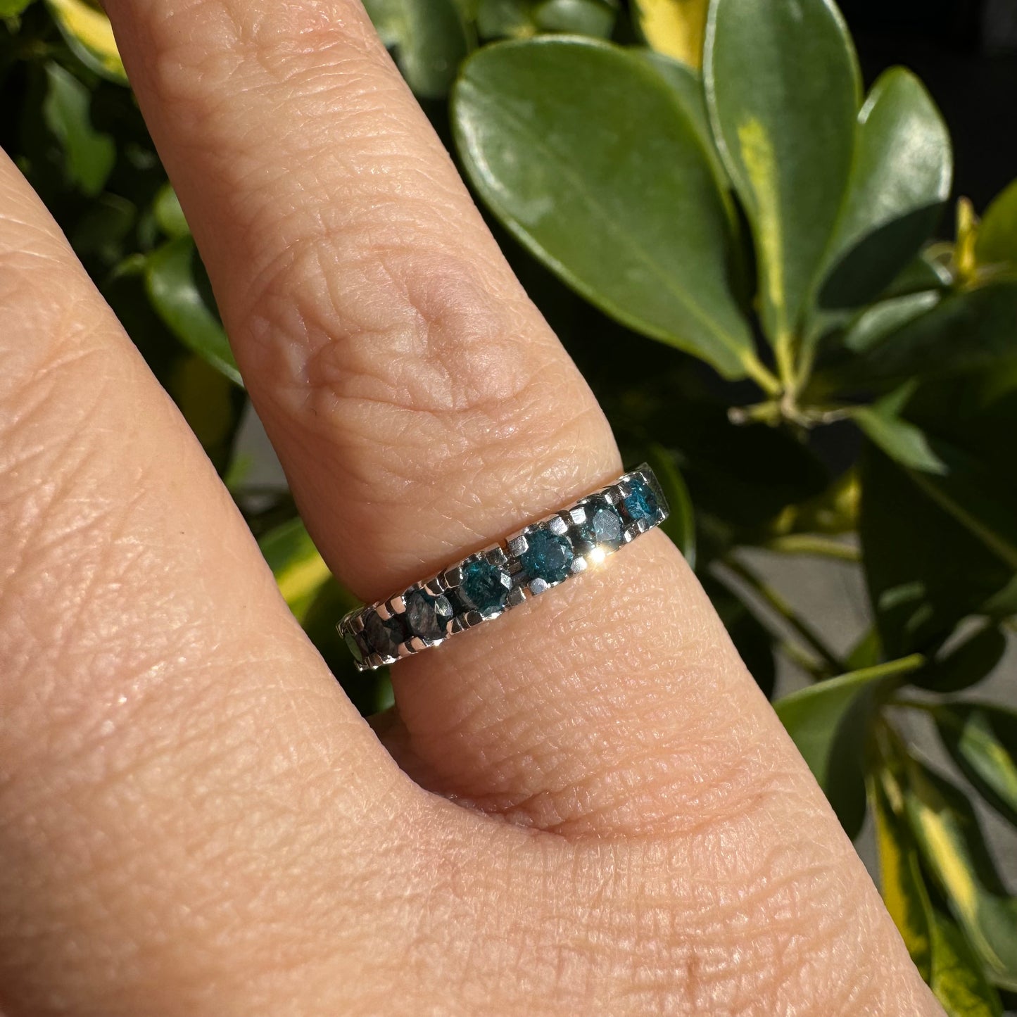 14K gold ring set with blue Diamonds