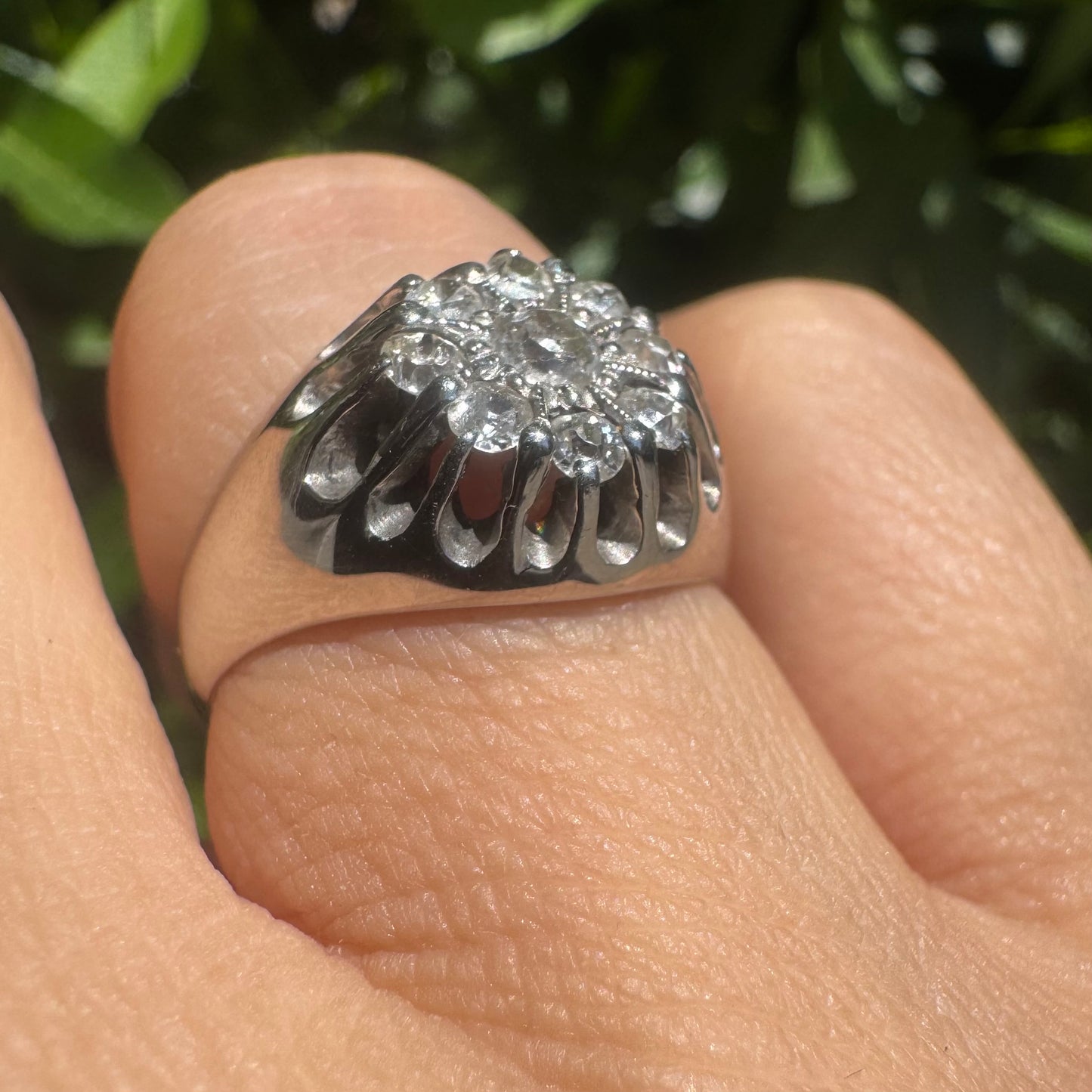 14K gold ring set with a cluster of old cut diamonds arranged in a floral design