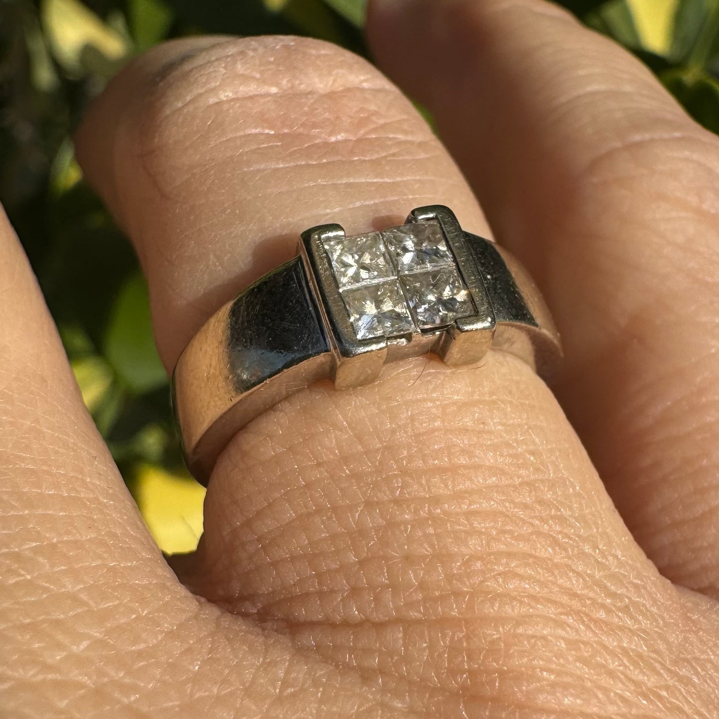 14K gold ring set with 4 square-cut Diamonds