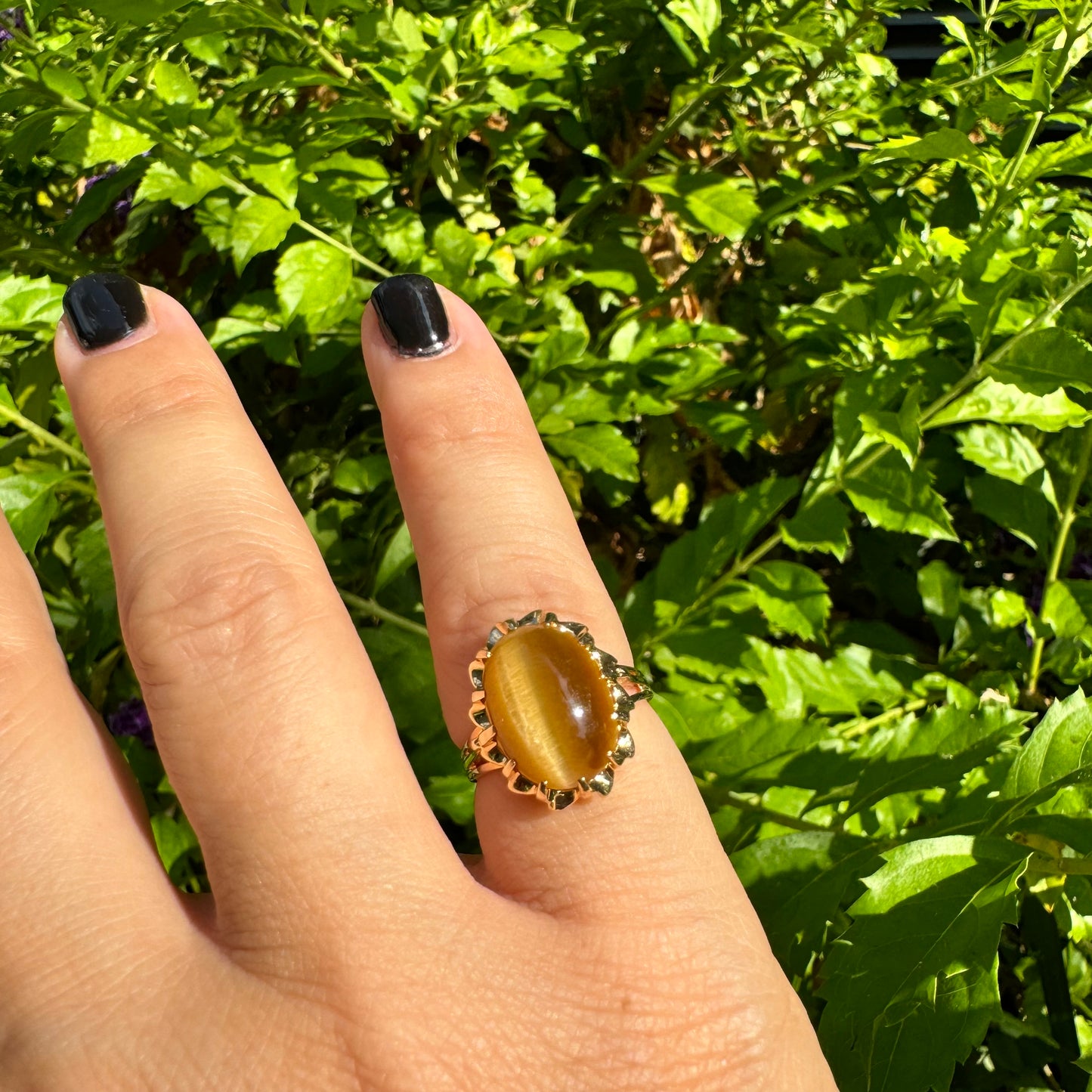 14K gold ring set with a yellow Tiger’s Eye cabochon