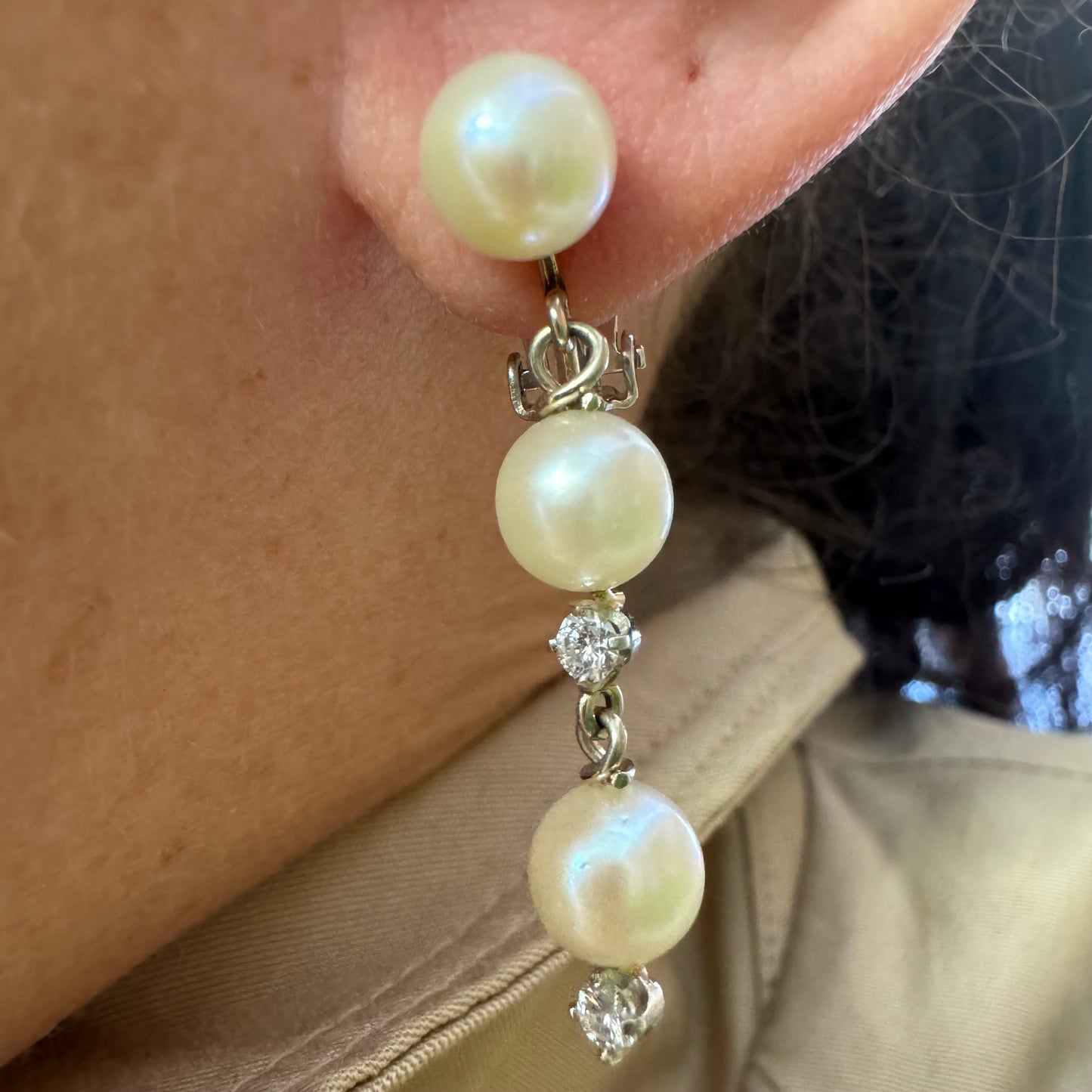 14K gold elegant drop earring set with three soft creamy Pearls connected by round brilliant Diamonds
