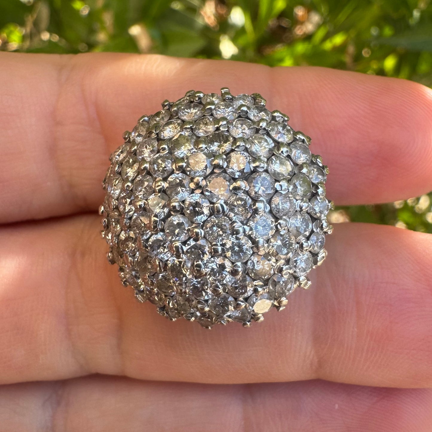 18K gold ring set with Diamonds in a bold pavé setting.