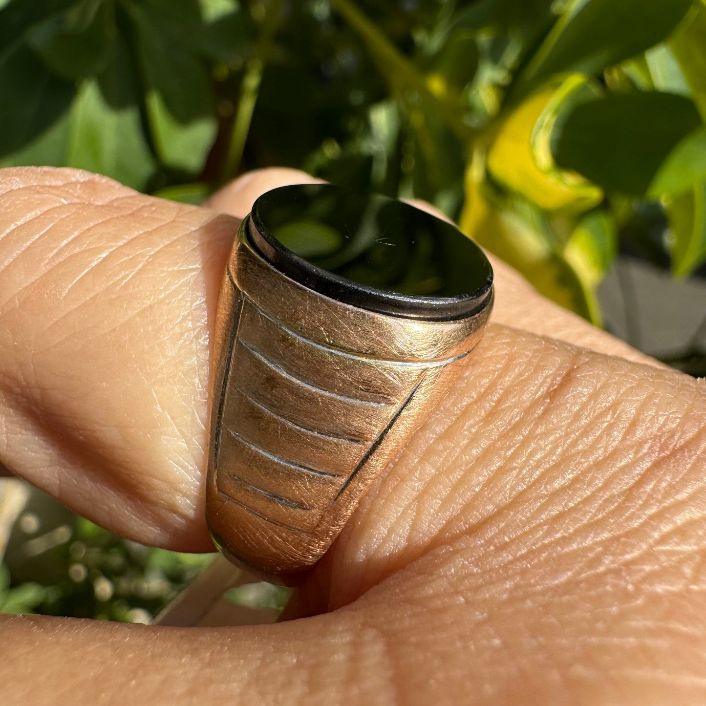 14K gold signet ring crafted in yellow gold, set with a smooth Black Onyx.