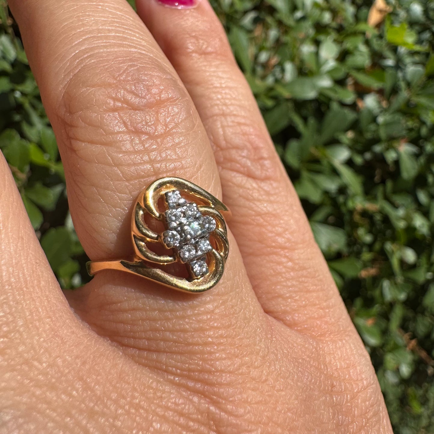 14K gold set with a cluster of sparkling Diamonds at its center