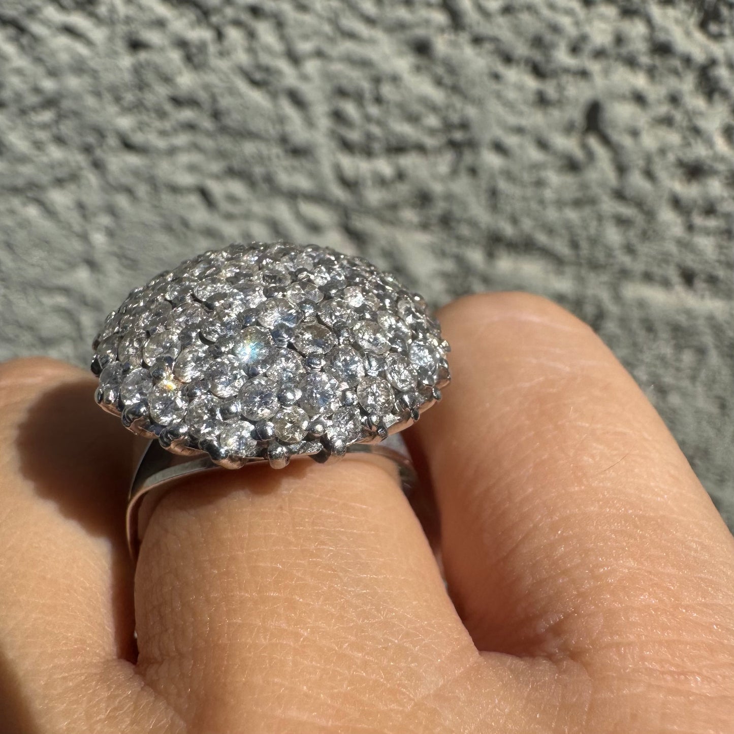 18K gold ring set with Diamonds in a bold pavé setting.