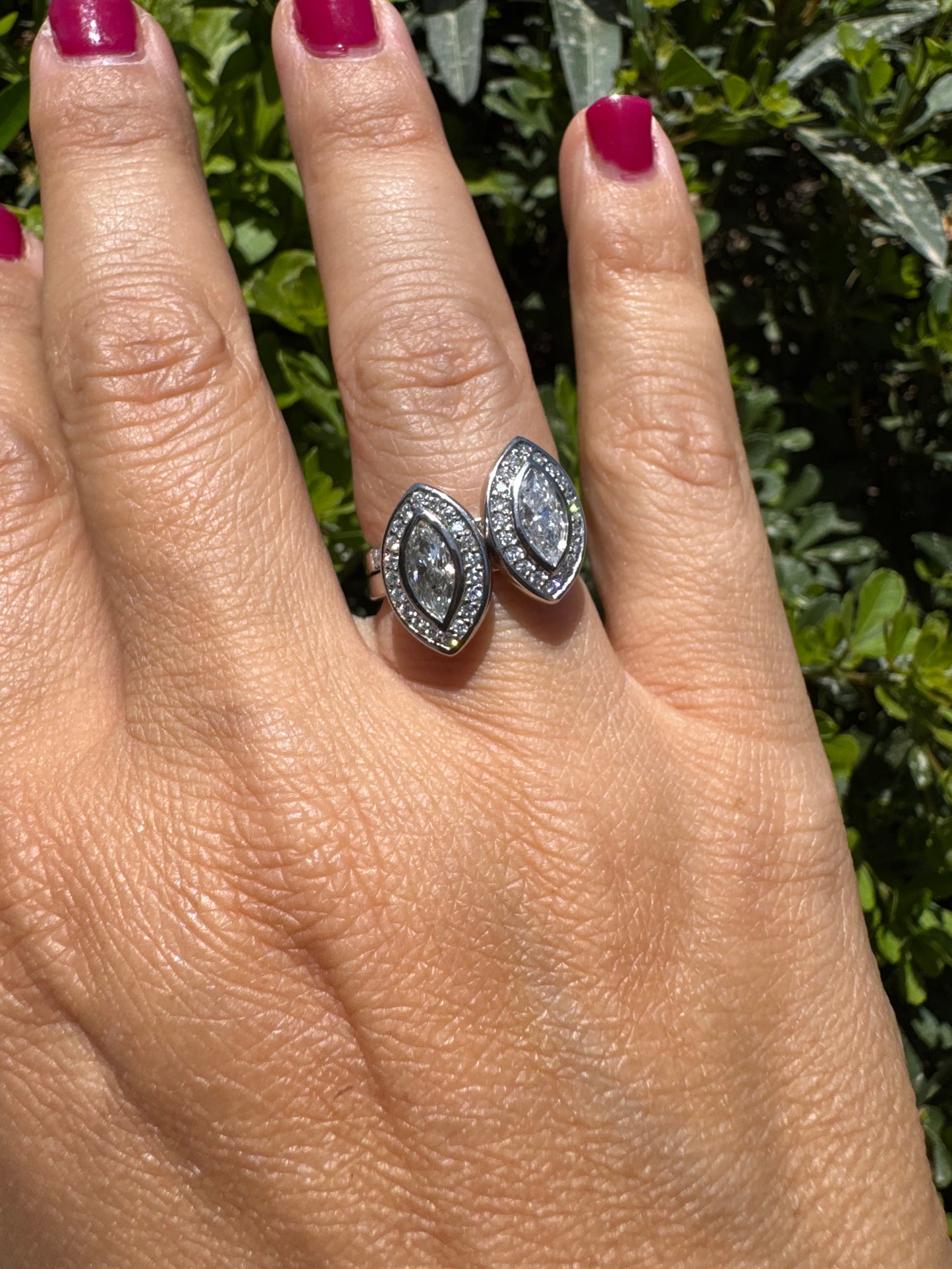 18K gold convertible ring set with two marquise-cut diamond halos that magnetically connect into a bold statement piece