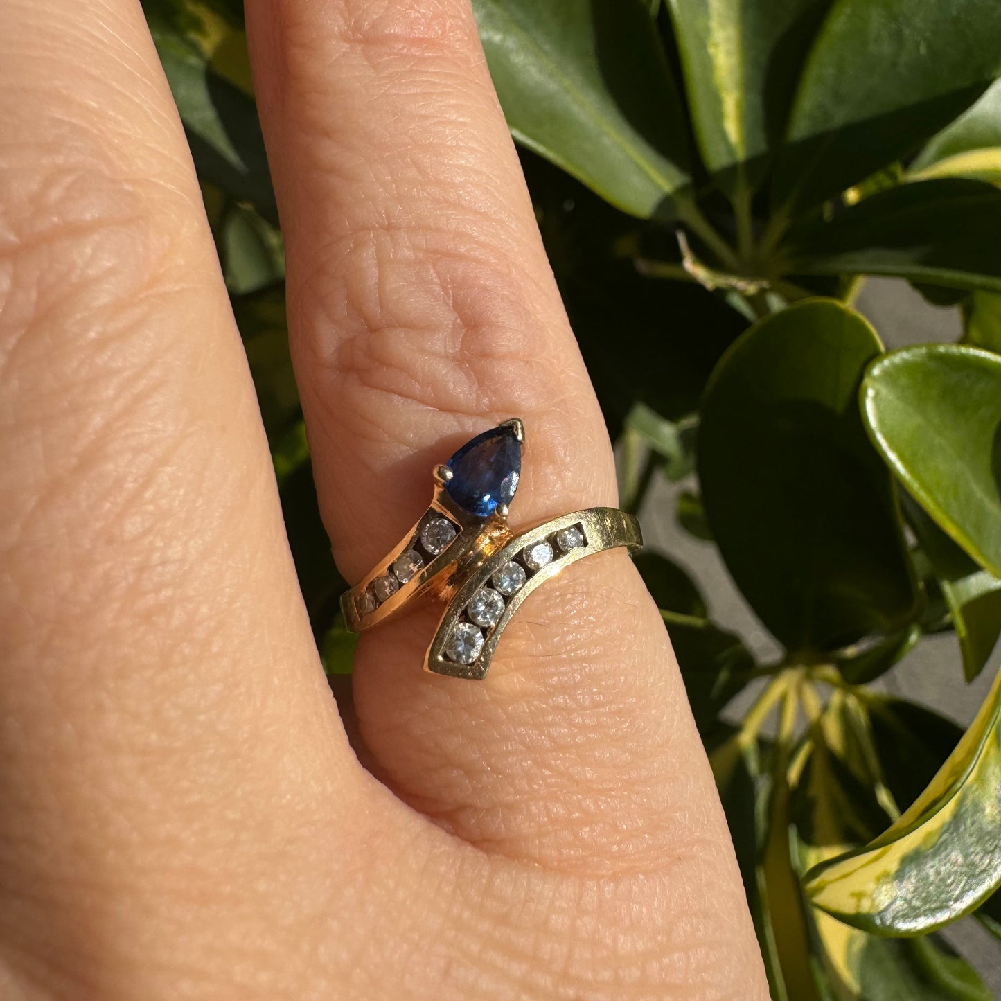 14K gold ring set with a teardrop-shaped Sapphire & Diamonds