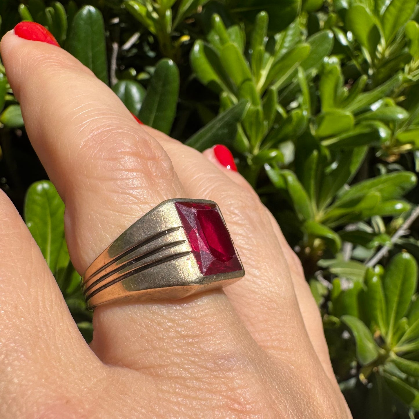 10K gold ring set with a bold red rectangular gemstone
