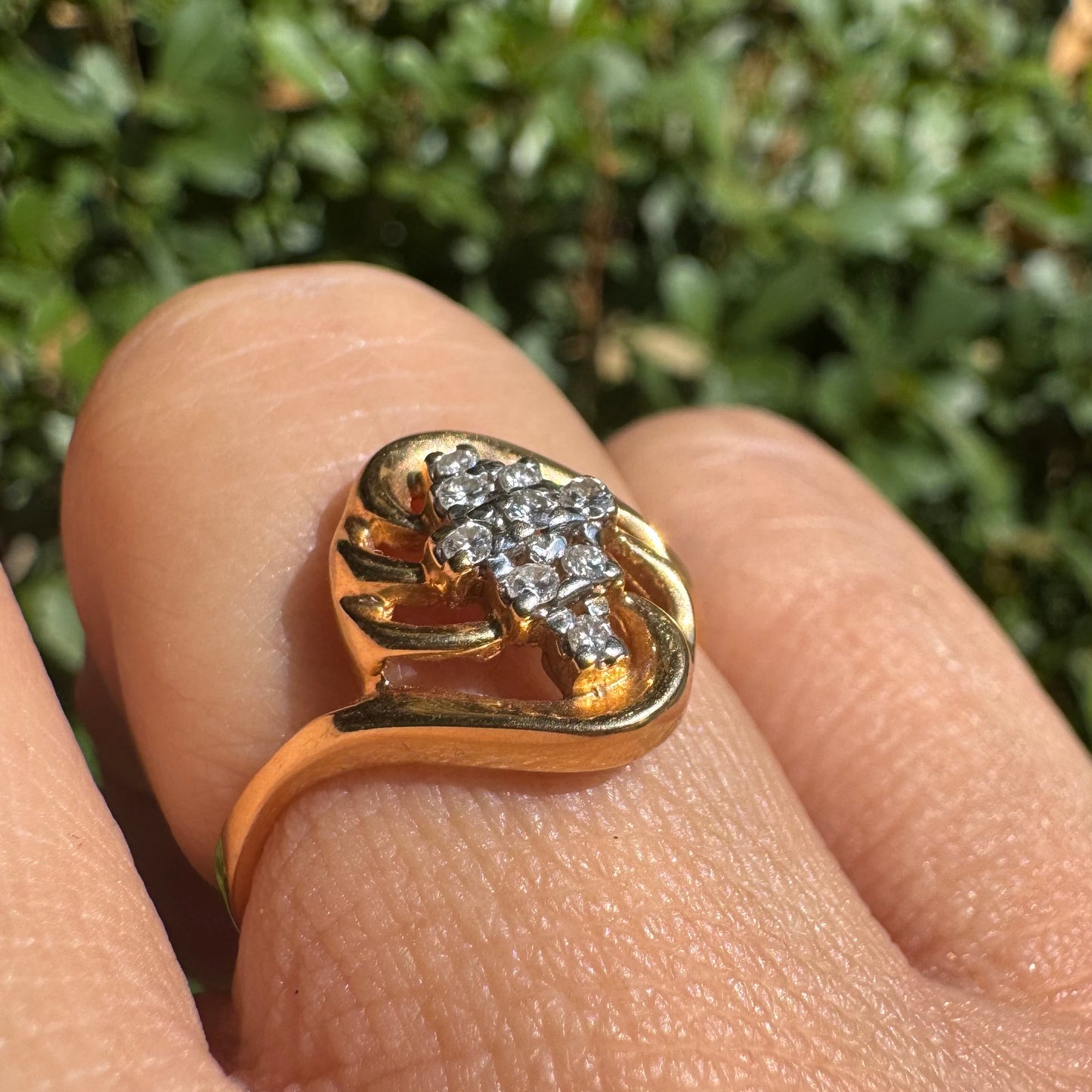 14K gold set with a cluster of sparkling Diamonds at its center