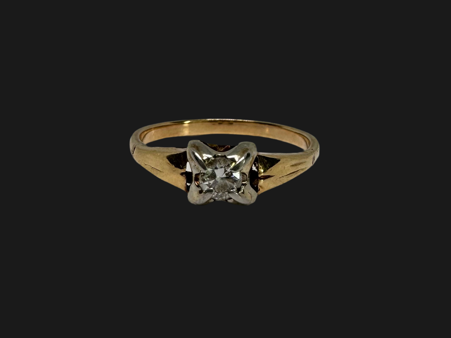 14K gold ring set with one center Diamond