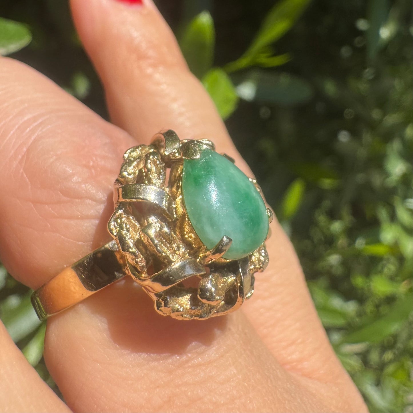 14K gold ring set with a pear-shaped Jade cabochon