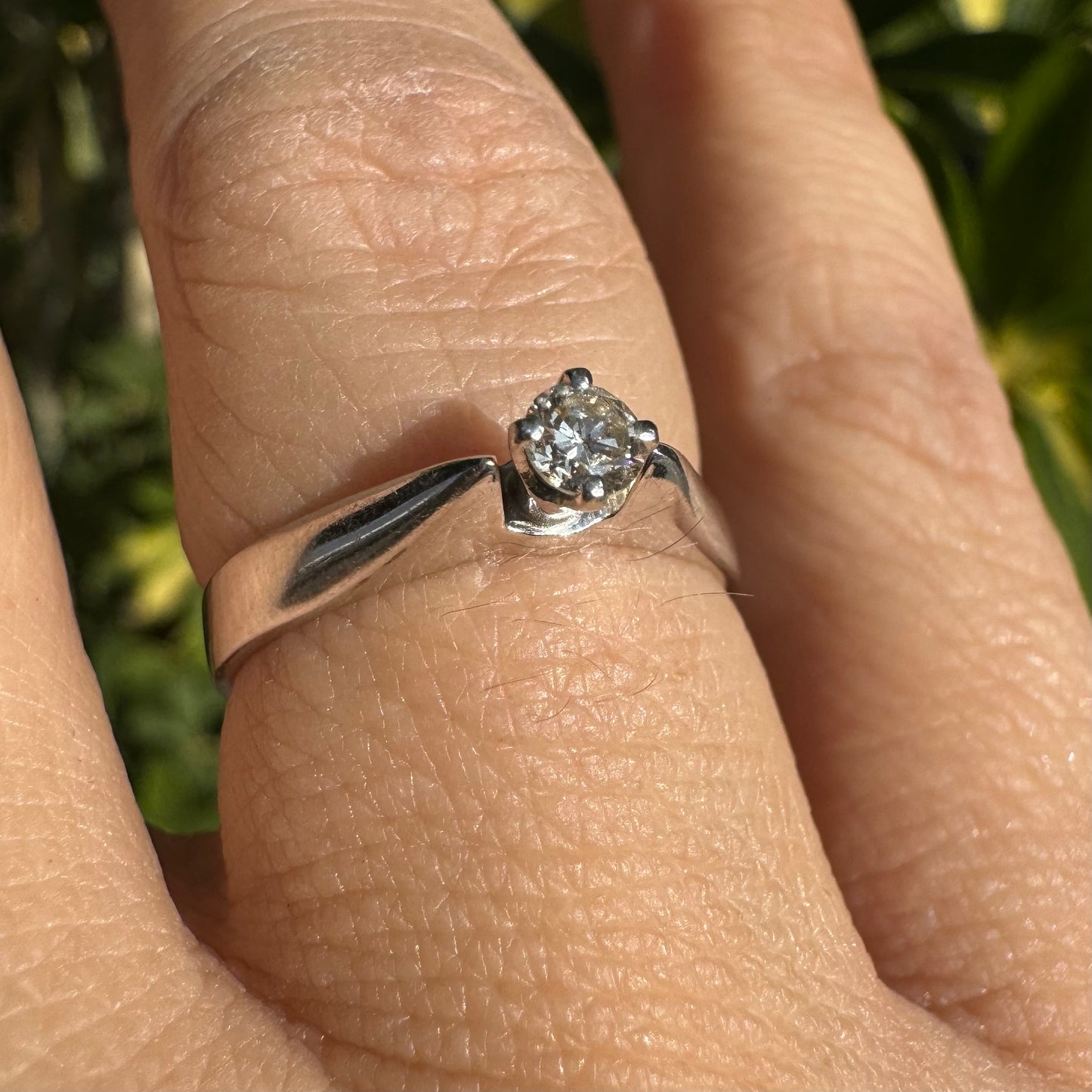 14K gold ring set with one center Diamond