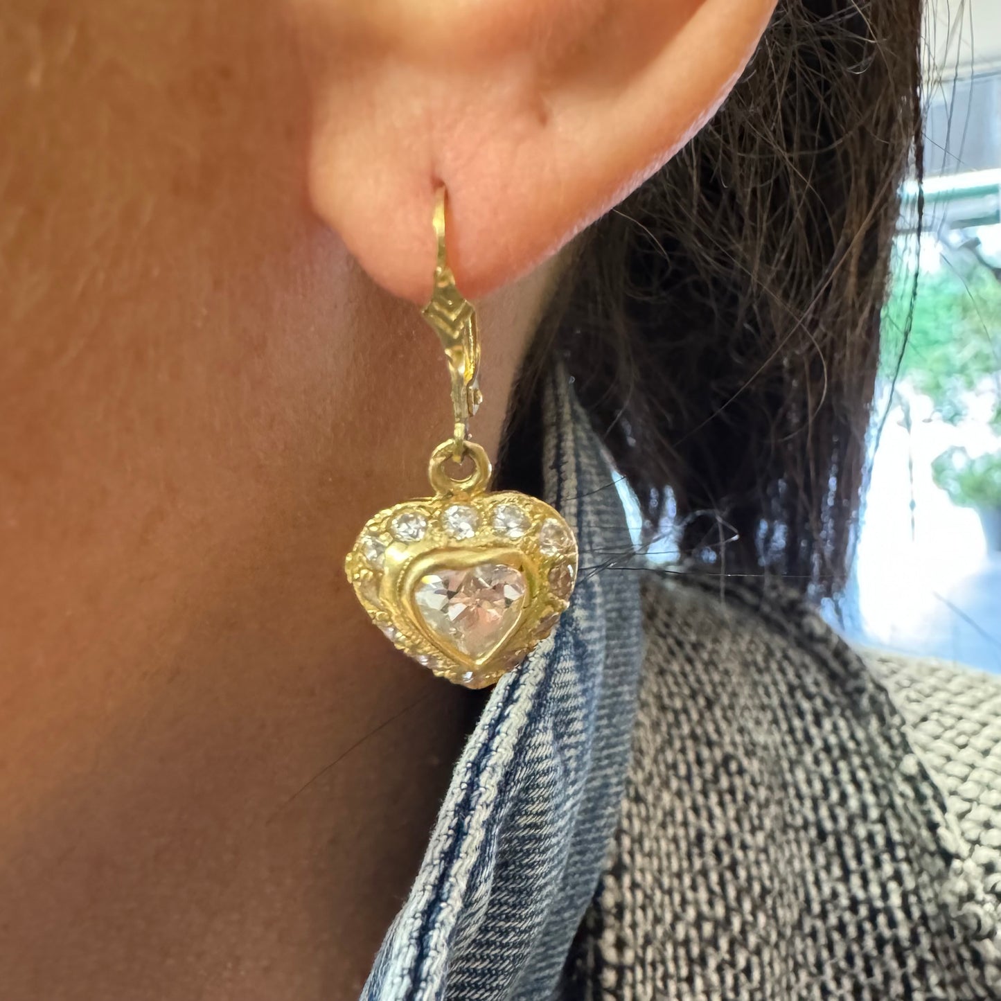 14K gold drop earrings set with a heart-cut central stone & surrounded by a halo of delicate gems.