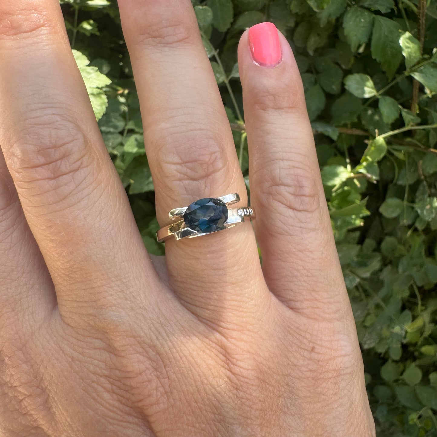 14K gold ring set with an oval-cut Blue Topaz “London”