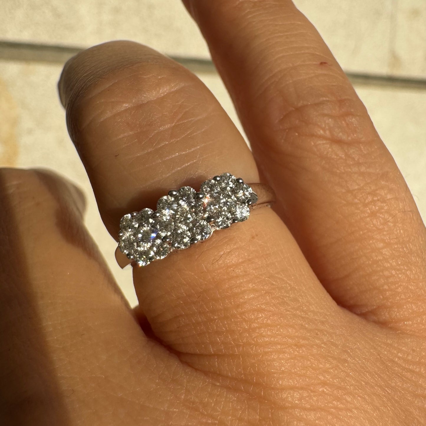 14K white gold ring set with clusters of brilliant white Diamonds