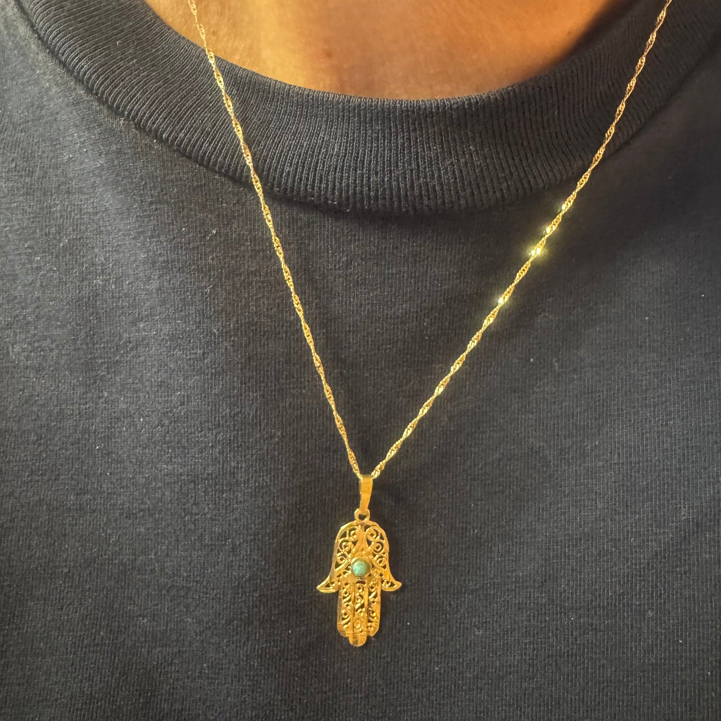 14K gold necklace with “Hamsa” pendant set with a center Turquoise stone