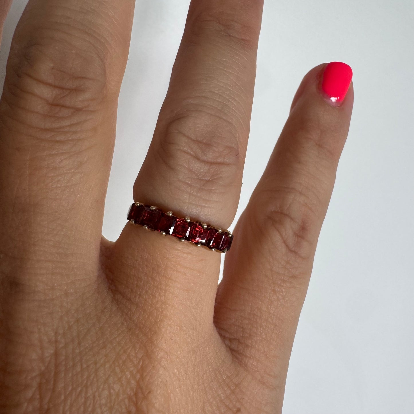 9K gold ring set with deep red garnets