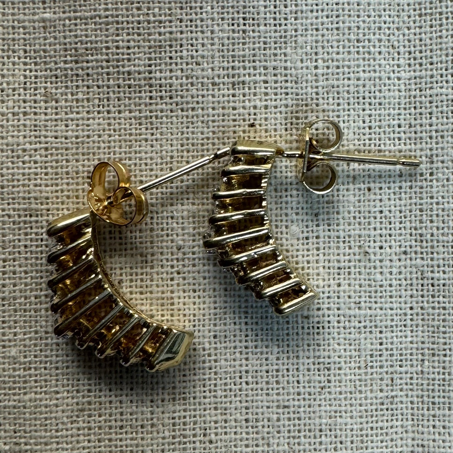 14K gold half-hoop earrings set with sparkling Diamonds in a dense pavé setting