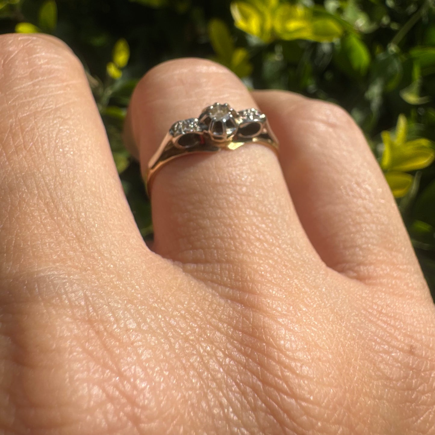 18K gold ring set with an old-cut center Diamond & side Diamonds