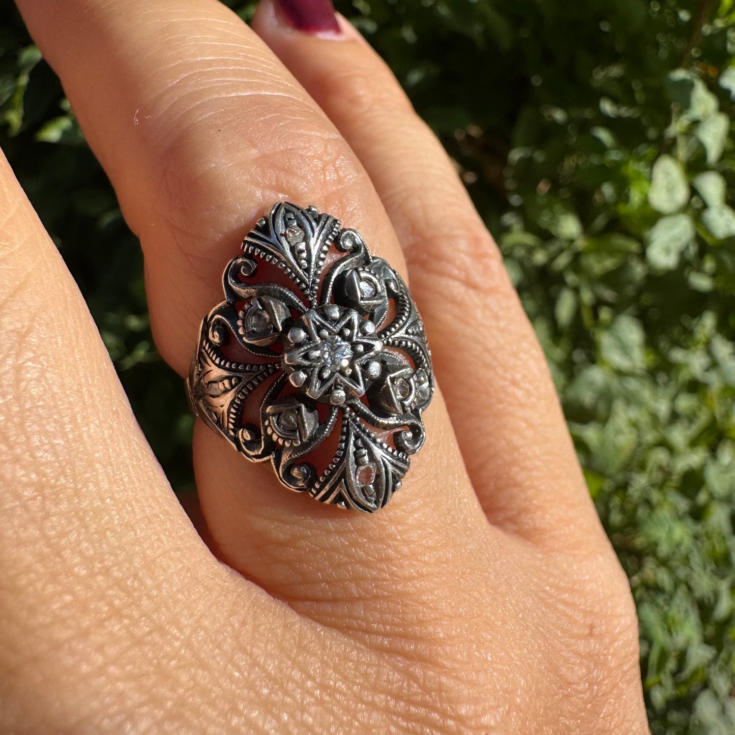 18K gold & silver ring with an intricate floral and leaf filigree design set with Diamonds
