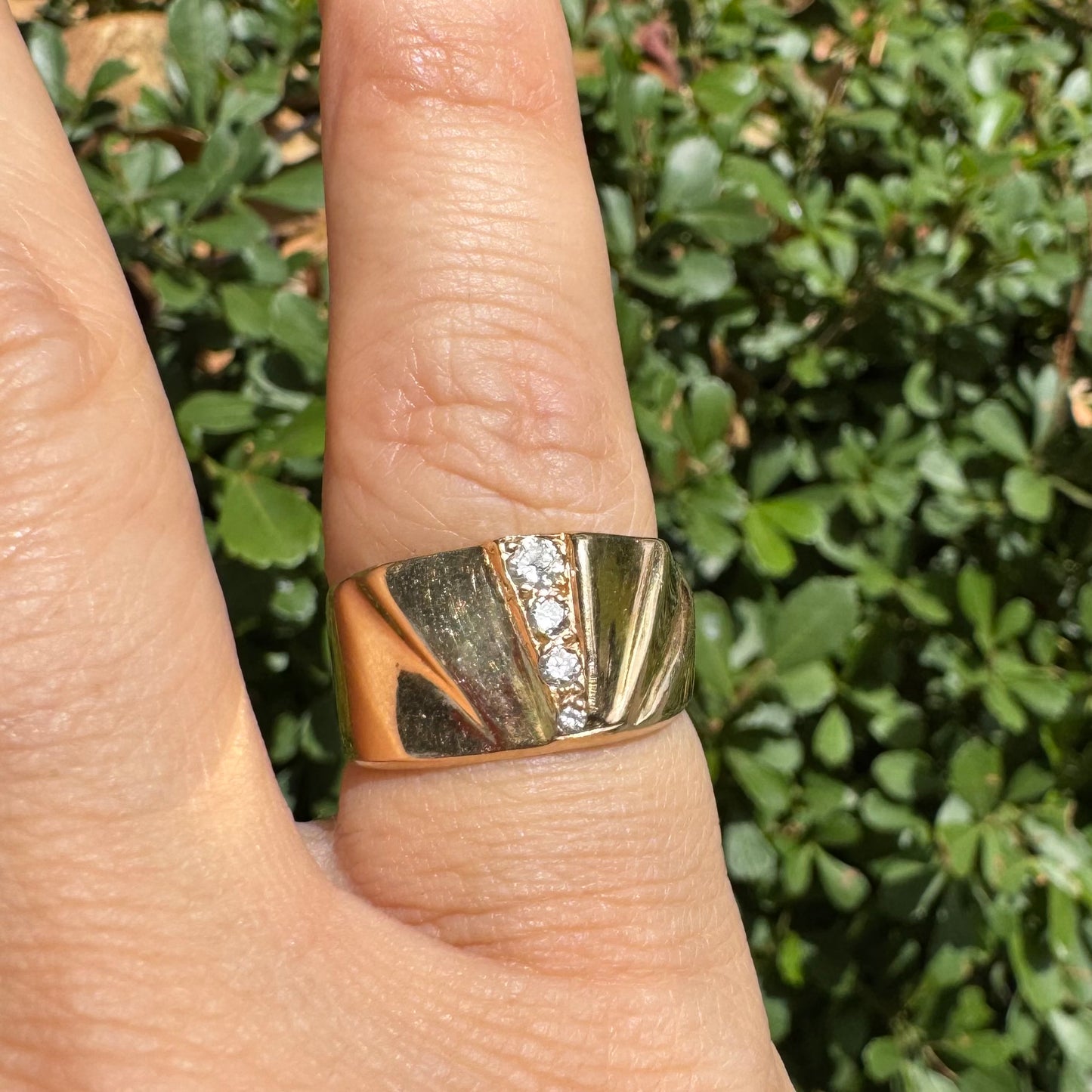 14K gold ring set with Diamonds featuring a fan-like geometric design