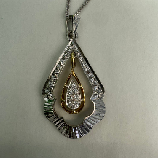 14K white and yellow gold pendant in a unique geometric design set with Diamonds
