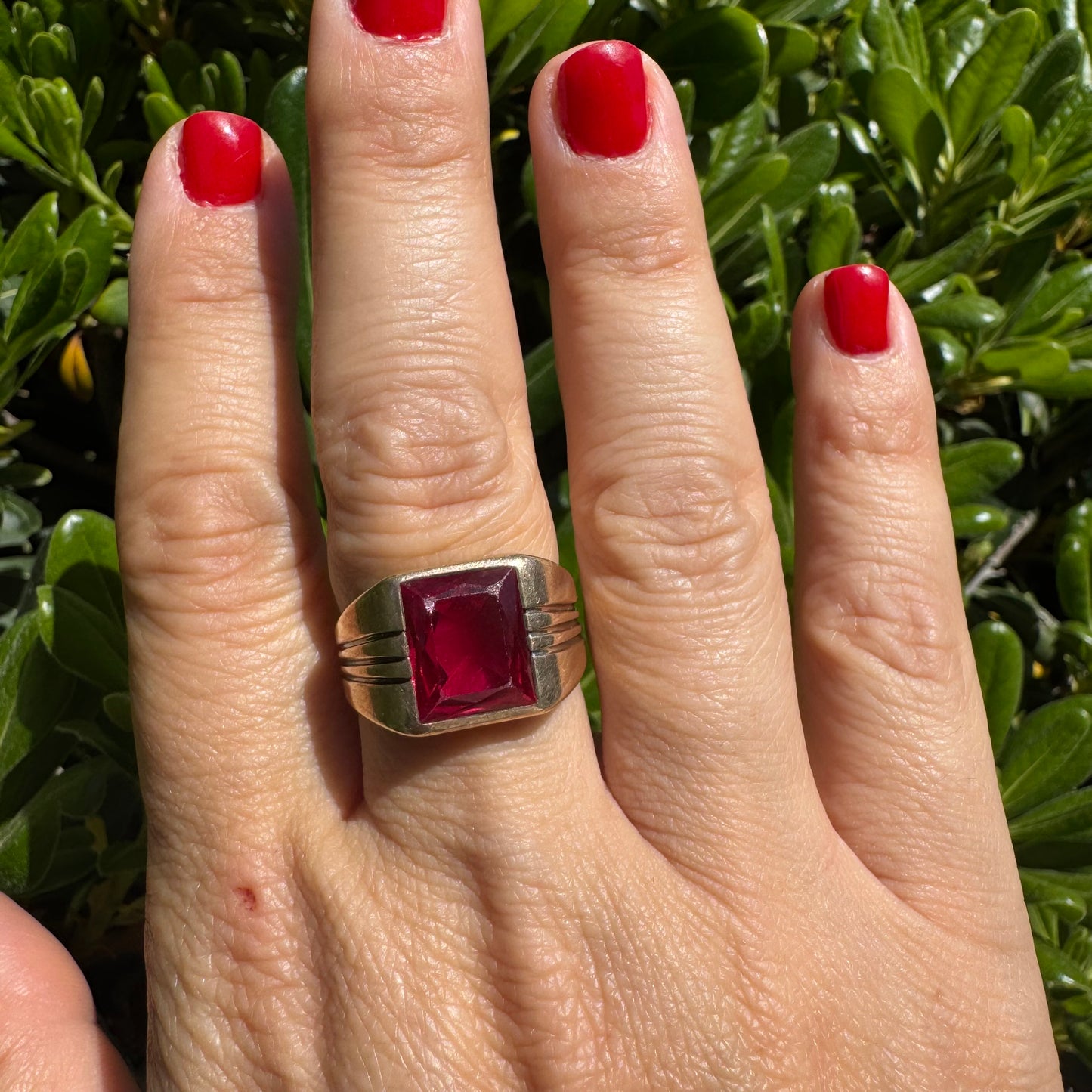 10K gold ring set with a bold red rectangular gemstone